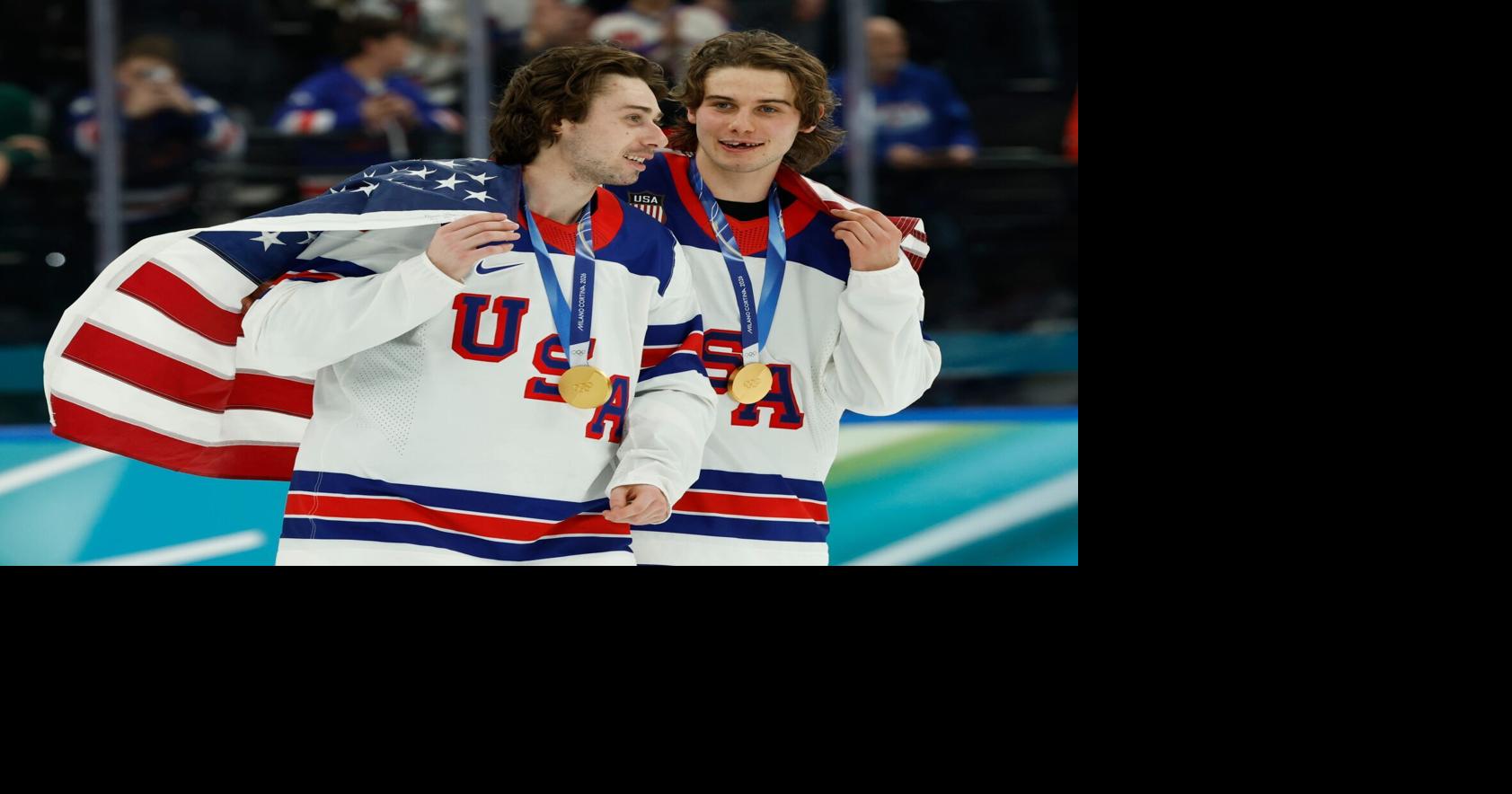 Feb 22, 2026; Milan, Italy; Quinn Hughes (43) of the United States and Jack Hughes (86) of the United States celebrate after defeating Canada in the men's ice hockey gold medal game during the Milano Cortina 2026 Olympic Winter Games at Milano Santagiulia
