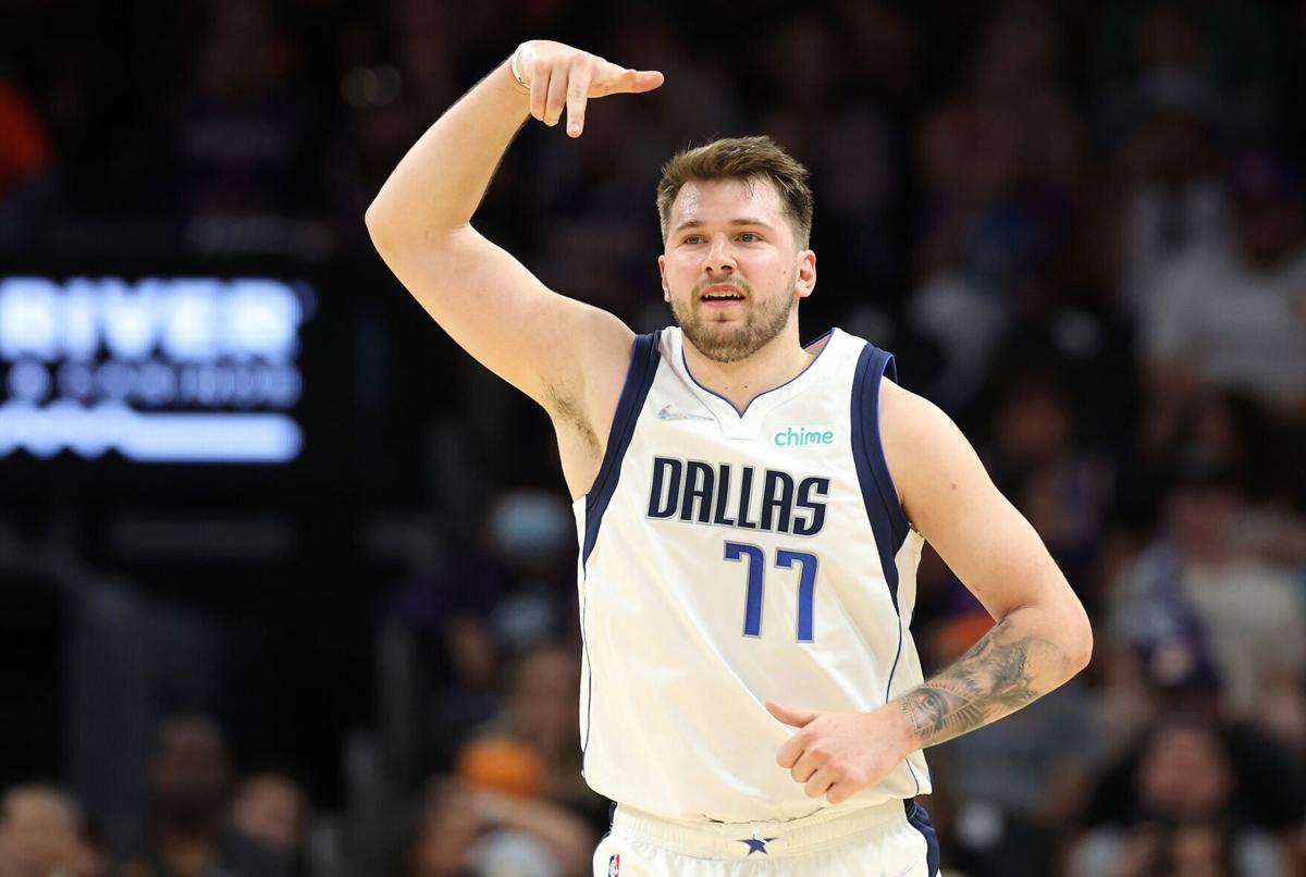 Luka Doncic of the Dallas Mavericks reacts after making a three-point basket during the third quarter against the Phoenix Suns in Game Seven of the 2022 NBA Playoffs Western Conference Semifinals at Footprint Center on Sunday, May 15, 2022, in Phoenix.