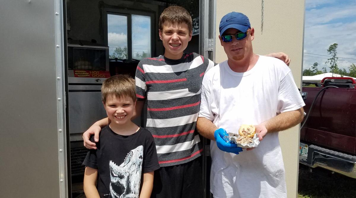 Dad and sons open hot dog stand