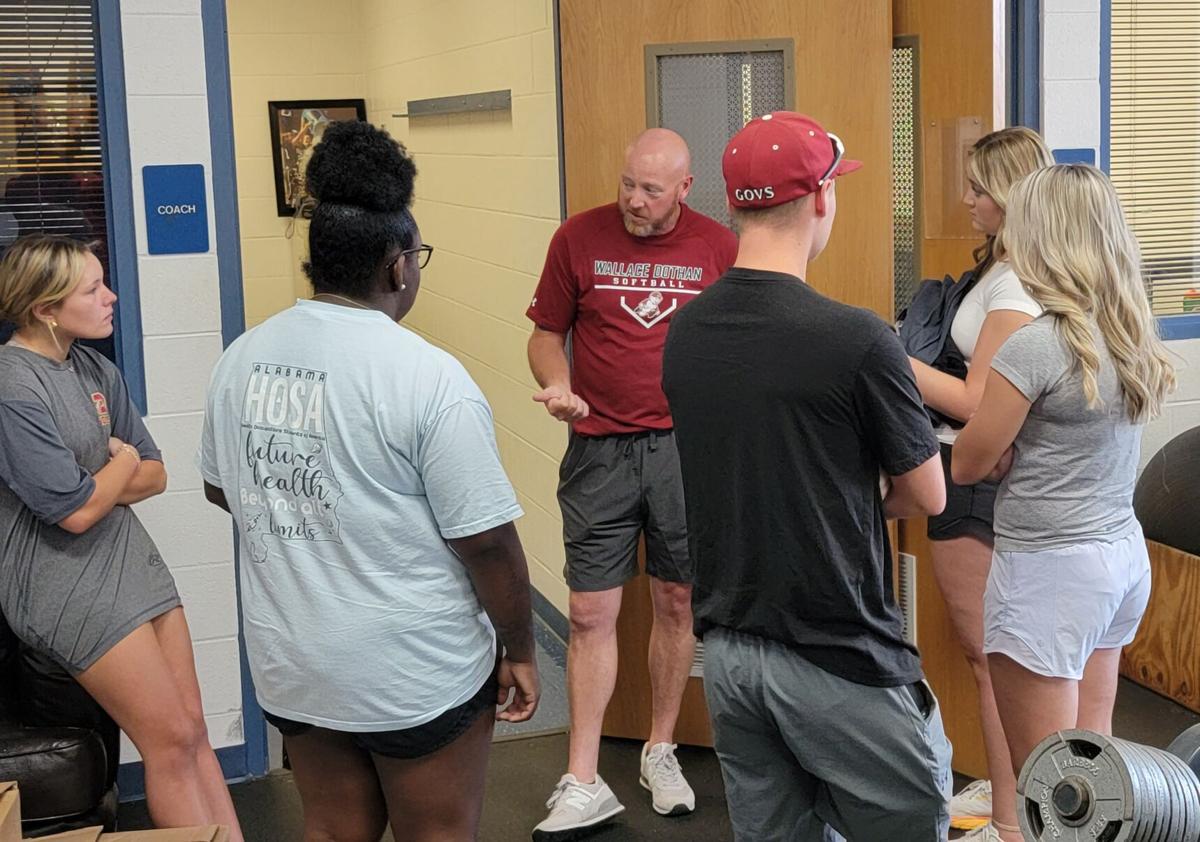 New Wallace softball coach David Dews meets with new team