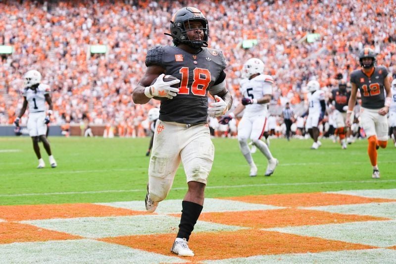 Tennessee defensive back Dejuan Lane celebrating after an interception return for a touchdown in 2026