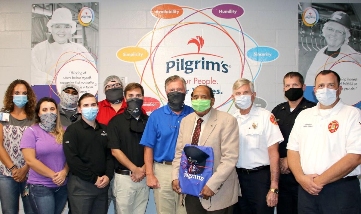 Enterprise leaders tour Pilgrim’s chicken processing plant