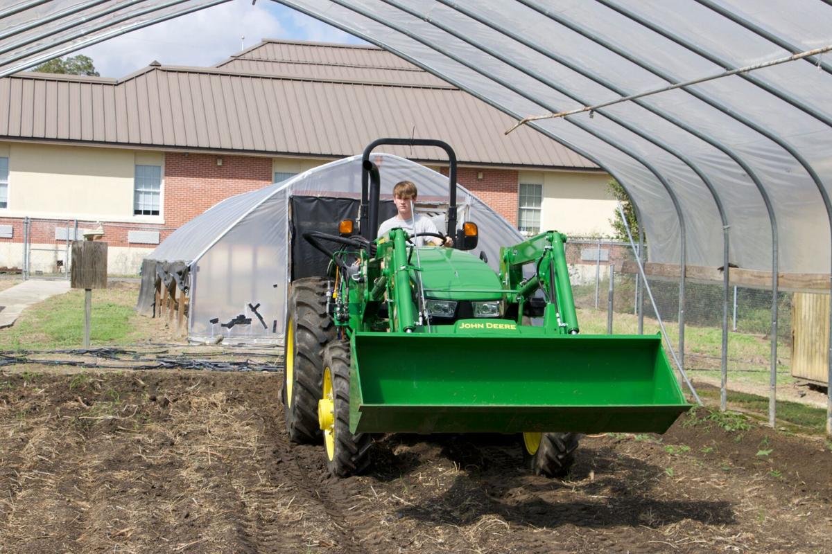WEC, Wiregrass RC&D fund purchase of tractor for Cottonwood FFA