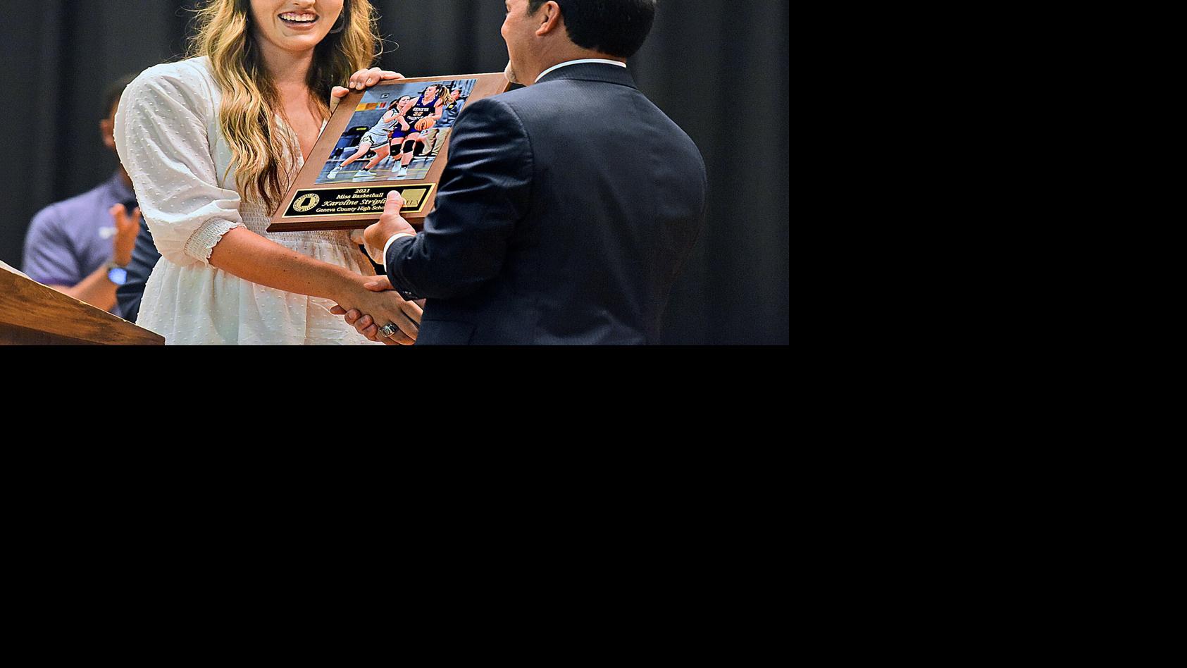DothanEagle.com - Geneva County's Karoline Striplin is presented with Miss Basketball award image