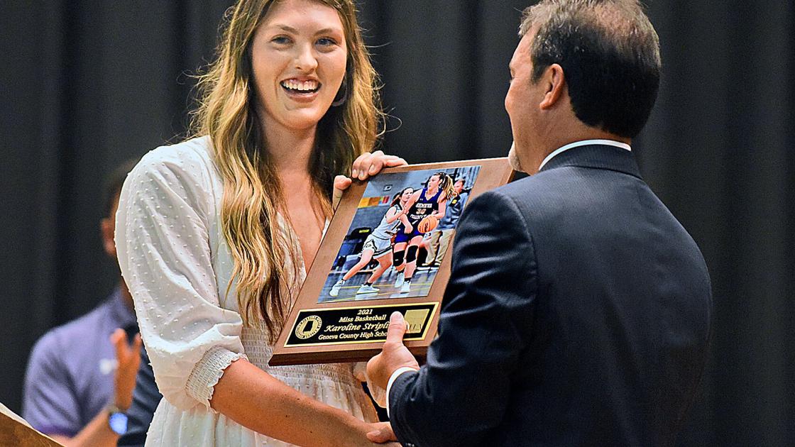 DothanEagle.com - Geneva County's Karoline Striplin is presented with Miss Basketball award image