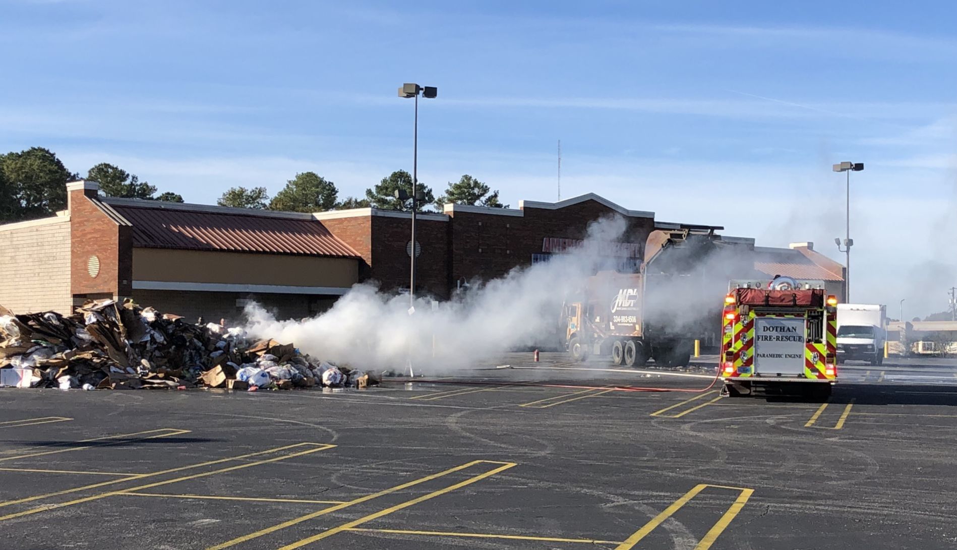 Dothan firefighters tackle blaze that begins in back of garbage truck