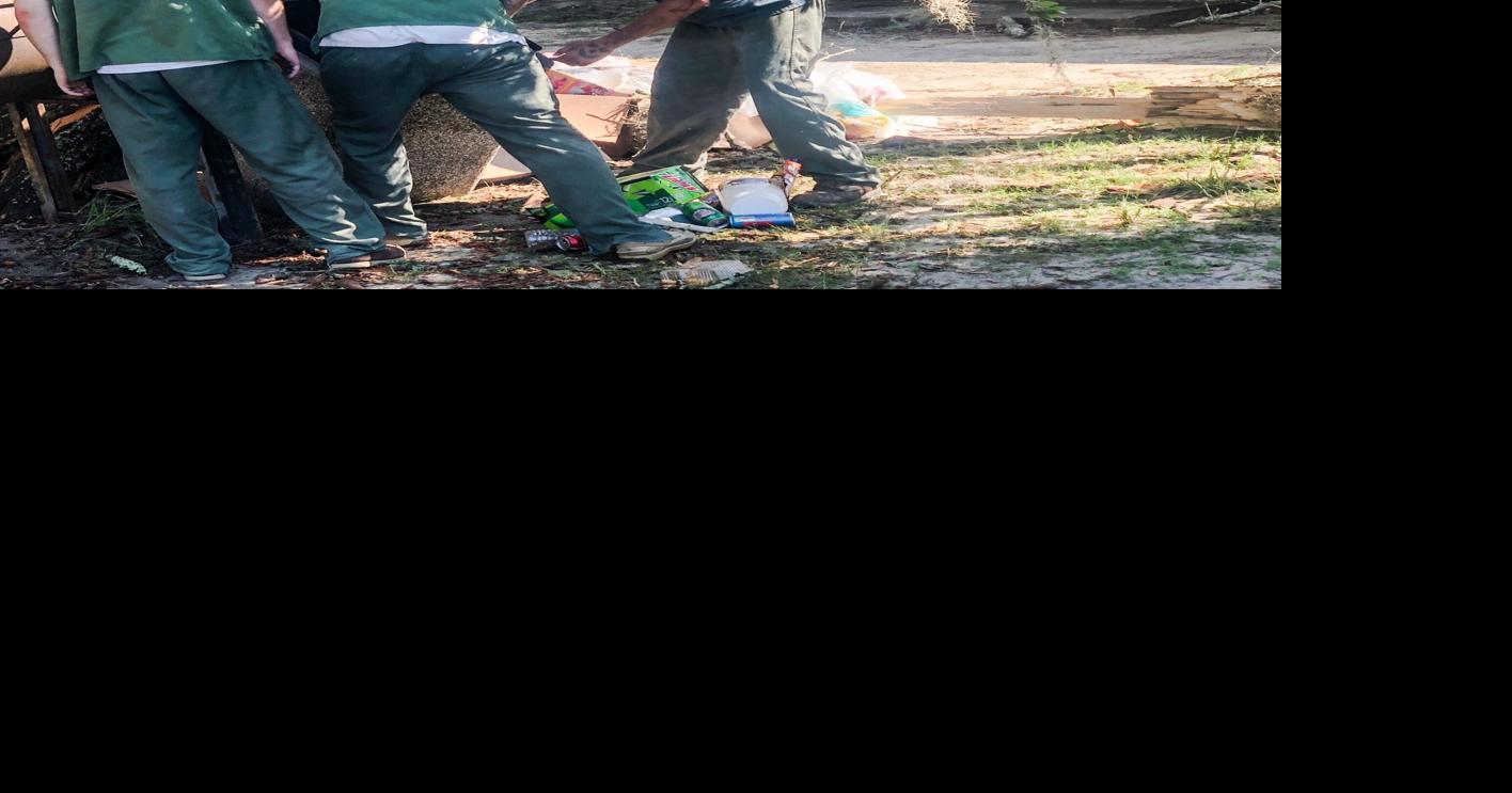 Inmates help clean up after storm