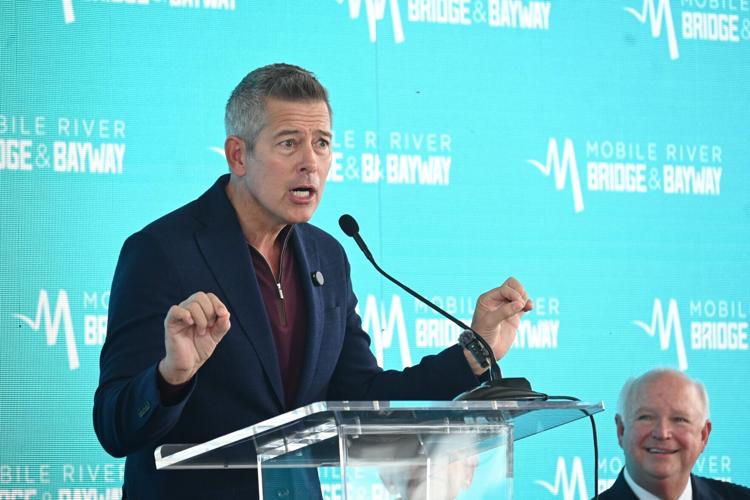 U.S. Transportation Secretary Sean Duffy does an impersonation of President Donald Trump during a groundbreaking ceremony for the Interstate 10 Mobile River Bridge and Bayway project on Friday, Oct. 2, 2026, at Cooper Riverside Park in downtown Mobile, ...