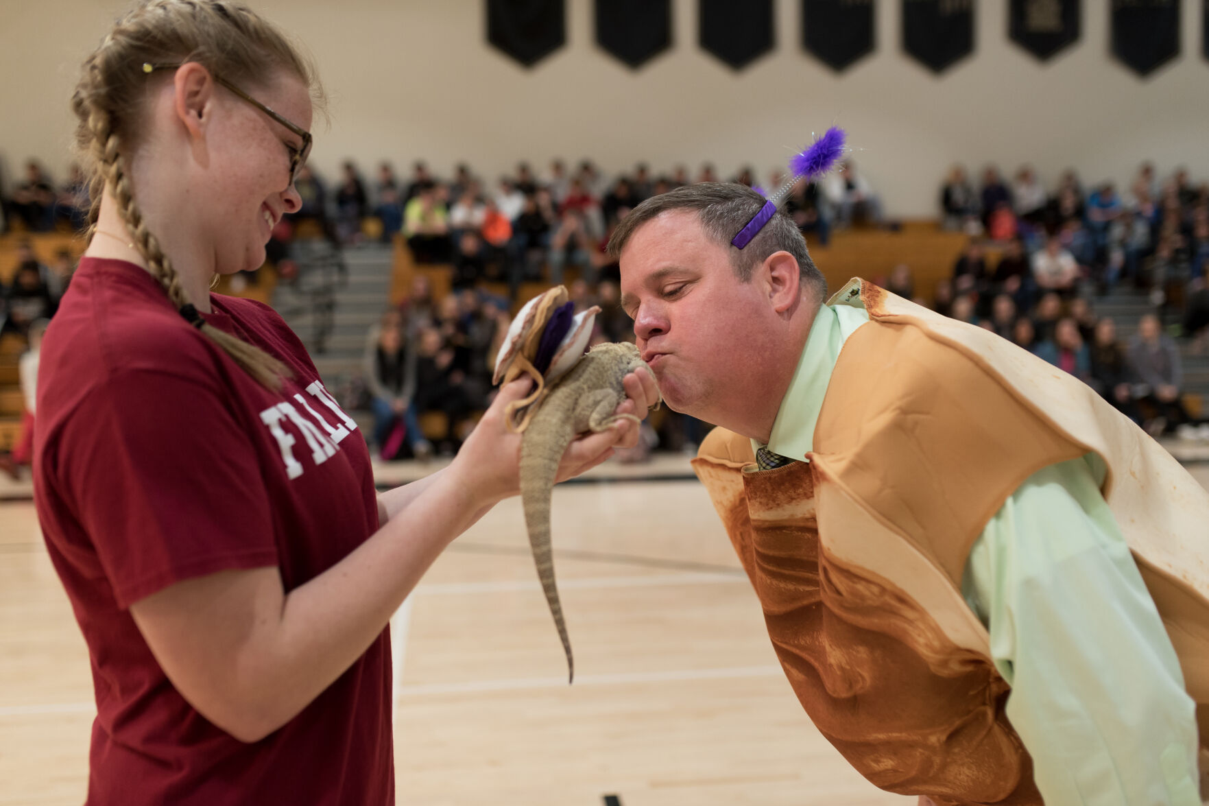 Principal pays debt by smooching Godzilla Local News