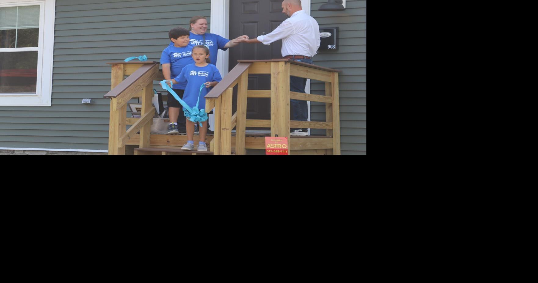New Habitat home ribbon cutting celebration