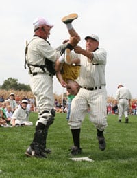 Ghost players catcher Marv Maiers leads the crowd in the wave