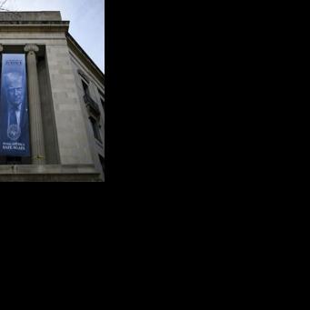 A banner featuring US President Donald Trump on display at the downtown Washington headquarters of the Department of Justice