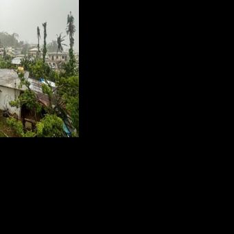 This picture shows a general view of a residential area as rain falls ahead of the arrival of the forecasted Super Typhoon Bavi in Saipan, Northern Mariana Islands