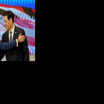 Colombia's President Abelardo de la Espriella (L) and US Secretary of State Marco Rubio embrace during a bilateral agreements signing ceremony in Barranquilla, Colombia