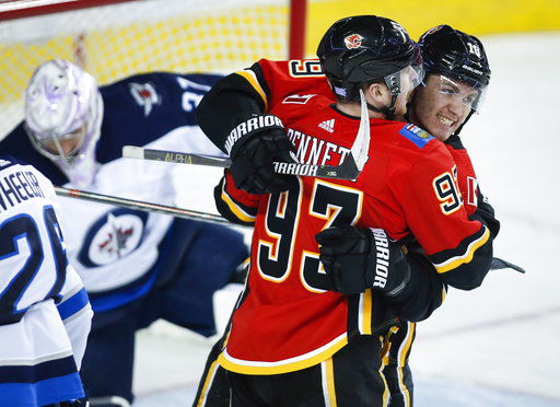 Flames score 5 goals in 1st period again to down Jets 6-3