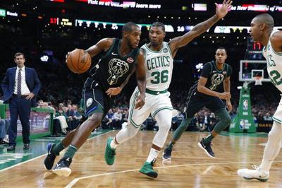 Irving scores 28, Celtics beat Bucks 117-113