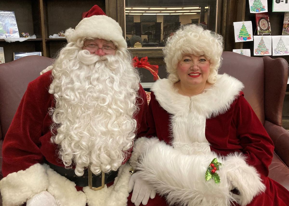 Santa Claus and Mrs. Claus hear from children at Spies Library event