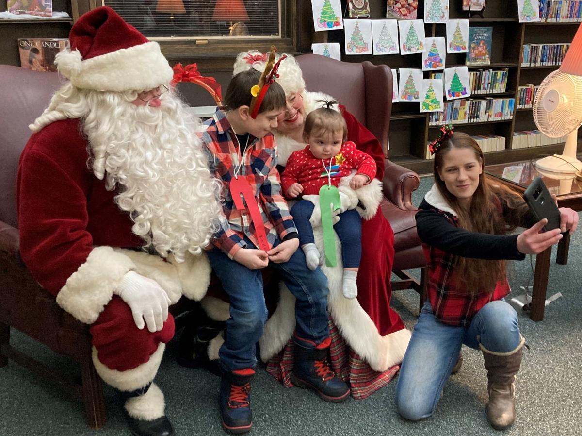Santa and Mrs. Claus visit children at Spies Library