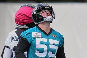 Long snapper cuts short camping trip and locates passport to sign with Jaguars in London