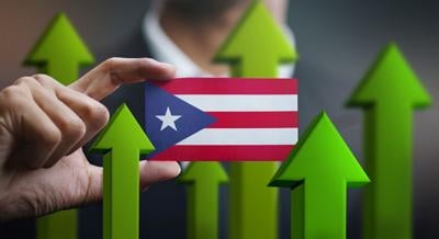 Nation Growth Concept, Green Up Arrows - Businessman Holding Card Puerto Rico Flag