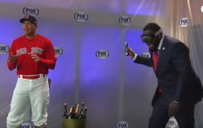 David Ortiz gives Alex Rodriguez a champagne shower while wearing a Red Sox  jersey