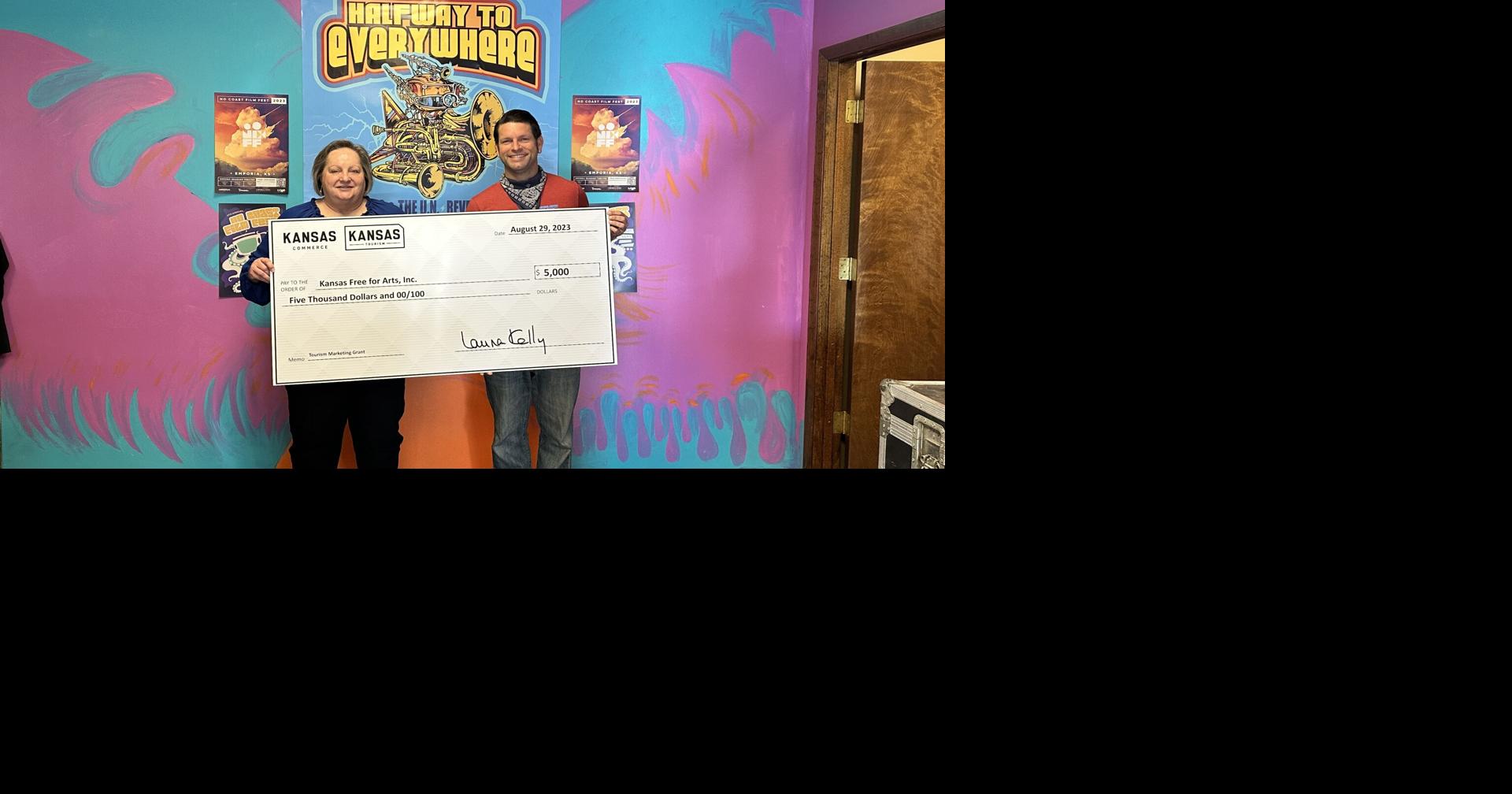 Kansas Tourism presents ceremonial check to Halfway to Everywhere Music