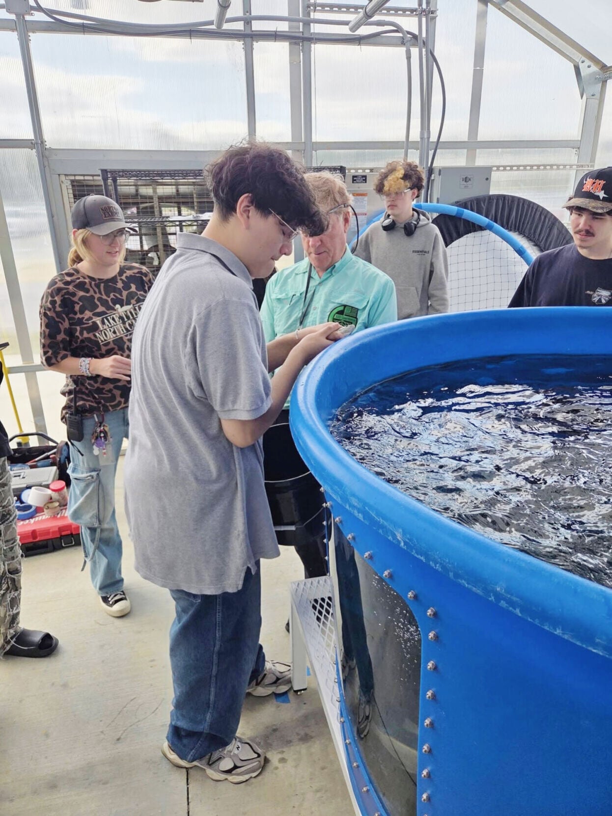 Fish swim alive in Forest Hills High aquaponic greenhouse | Enquirer ...