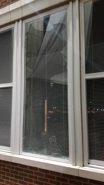Plumb Hall banner breaks window