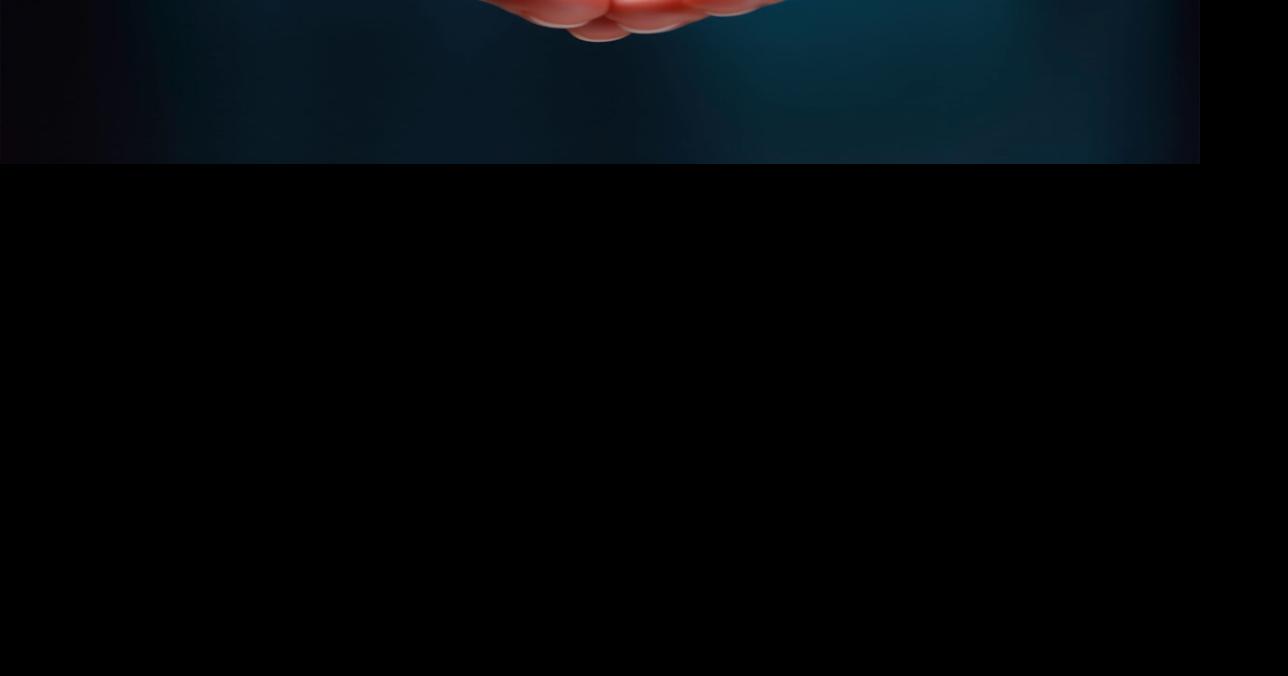 Abstract image of two hands holding a large blood droplet. Blood