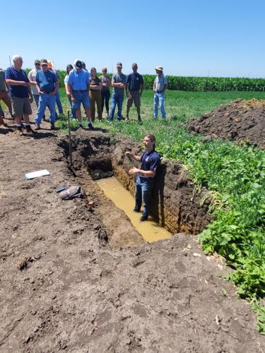 Andrew Margenot, Assistant Professor, University of Illinois, demonstrates cover crop growth below ground through use of a soil pit. This provided attendees an opportunity to learn more about Illinois soil types and the potential soil health benefits that cover crops can provide.