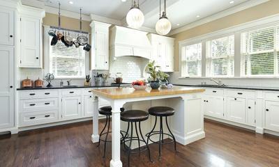 Kitchen with white cabinetry and center island