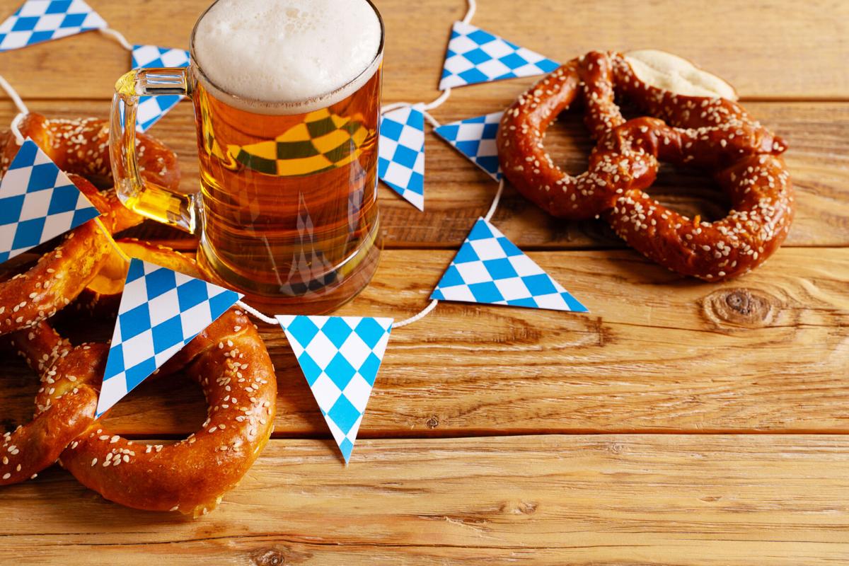 Beer Fest concept with pretzel and blue simbol flag on wood background