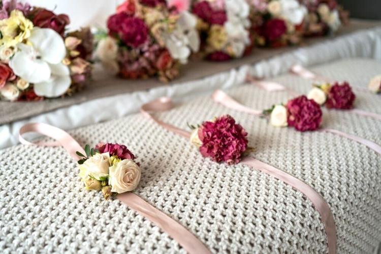 You can make these corsages out of wood flowers to save money on your wedding day