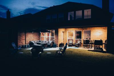Backyard lighting like this is important for safety and ambiance