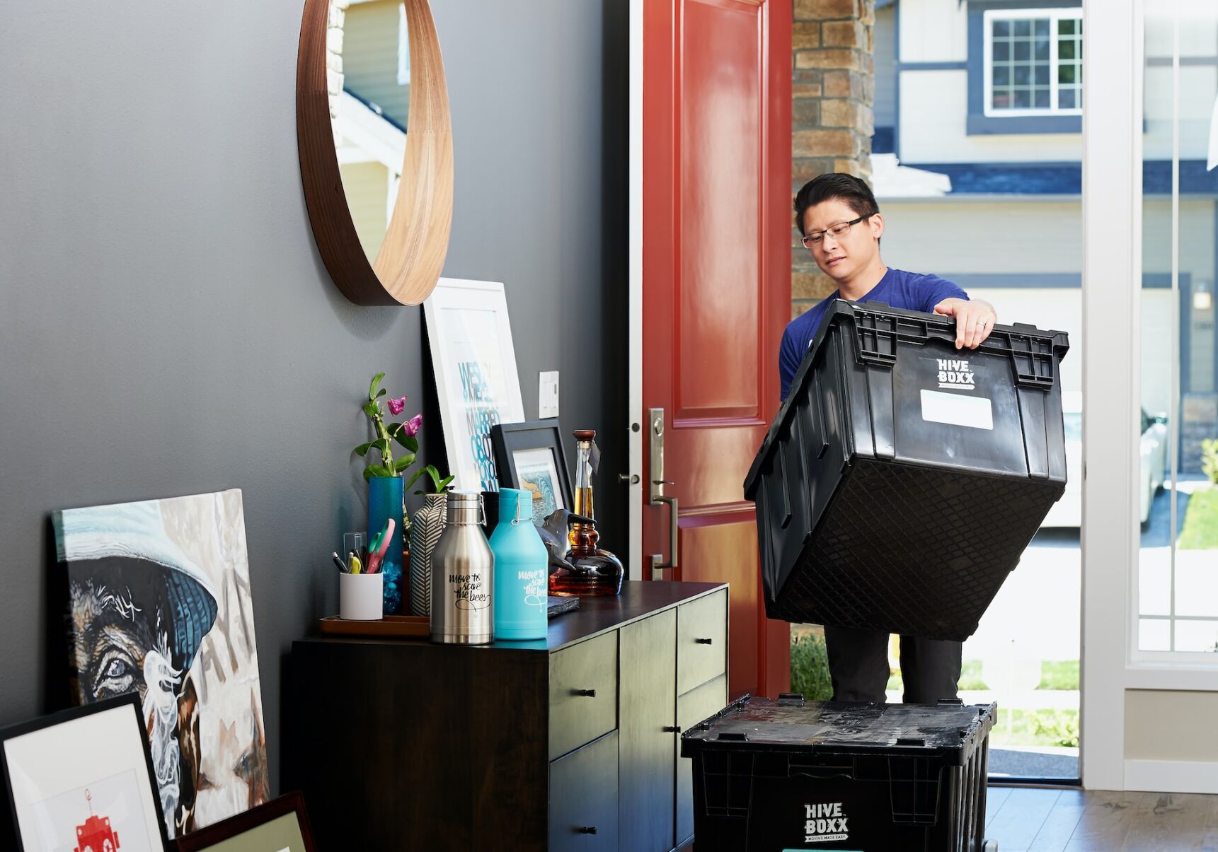 Person packs boxes in preparation for their cross-California move