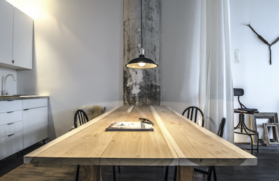 Kitchen table illuminated with stylish hanging pendant light