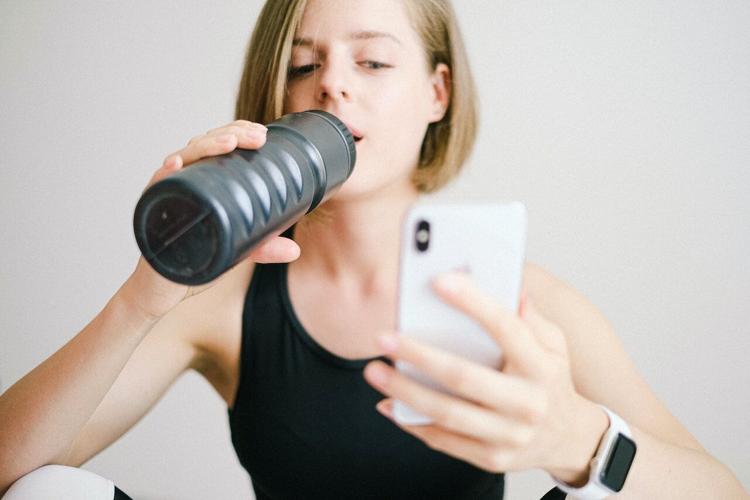 Woman drinks enough water for her health