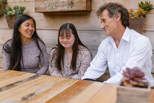 Two parents Living Comfortably at Home with their Autistic child
