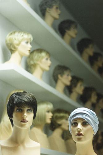 Manequins wearing wigs show off a variety of potential wig styles