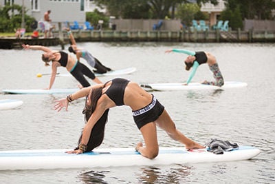 Why We Love Paddle Board Yoga (And You Should, Too!)