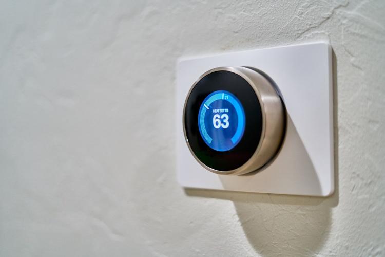 gray nest thermostat displaying