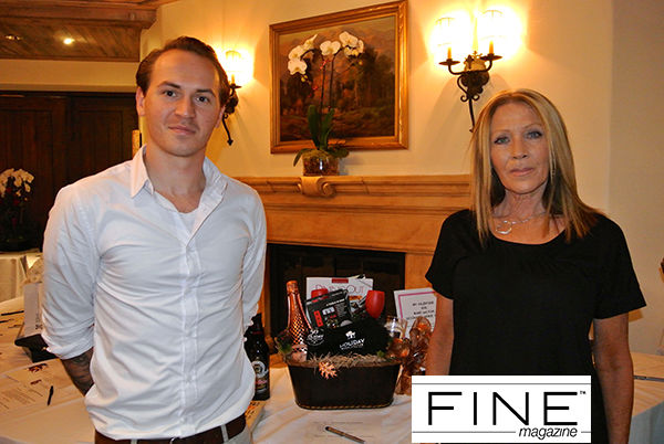 Mark_Hodges_and_Margie_Jackson_With_Holiday_Wine_Cellar