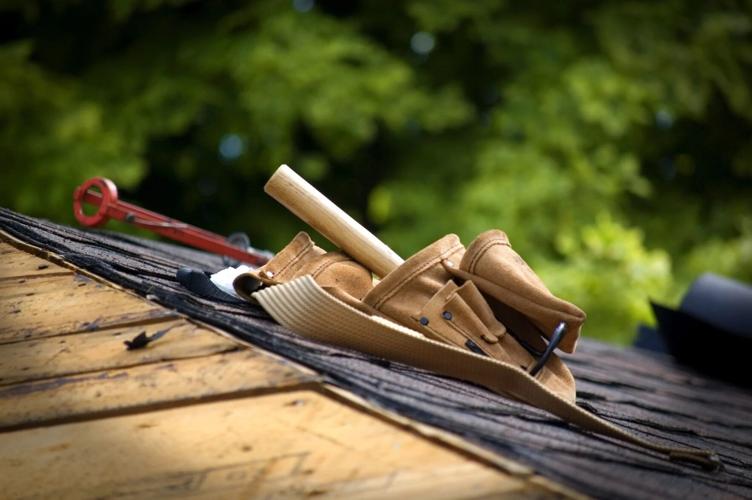 Tools sit on roof top during break from DIY roofing
