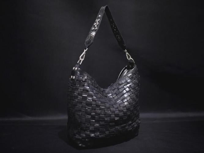 This black leather satchel bag is perfect for winter style