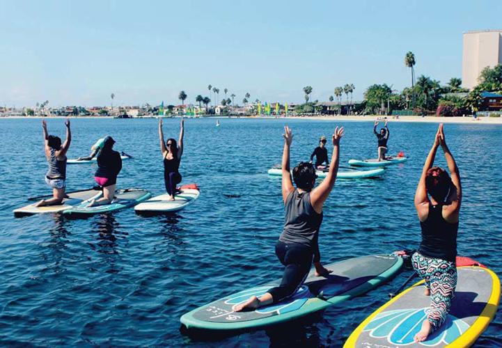 Why We Love Paddle Board Yoga (And You Should, Too!)