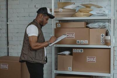 Man checks status of packages that are packed using polyeurethane foam
