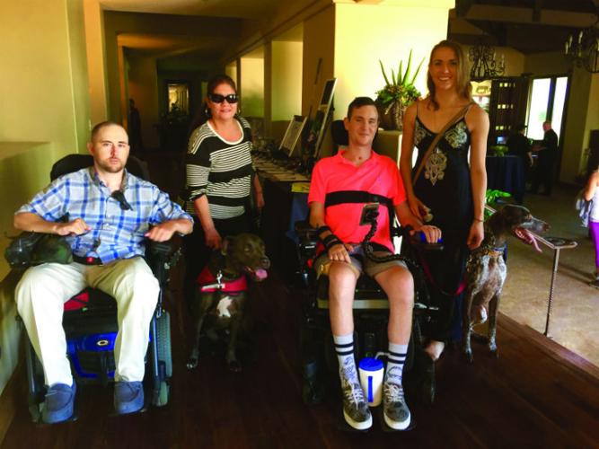 Freedom to Live Golf Tournament; ￼Nathan Lehmann, Millie Watts, Dillon Connolly & Kerry Sheridan with service dogs