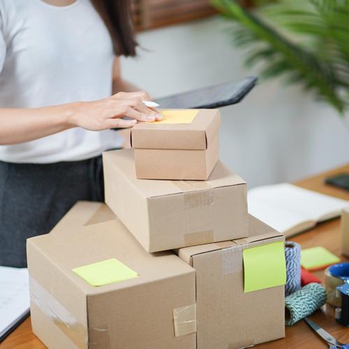 Person packages order from their automatic order management system