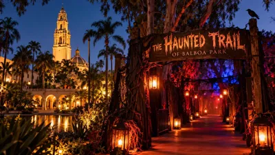 Halloween-themed illustration of Balboa Park in San Diego at night, featuring a haunted trail entrance, glowing lanterns and dramatic lighting.