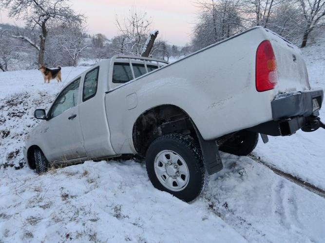 Car falls face first into snow ditch